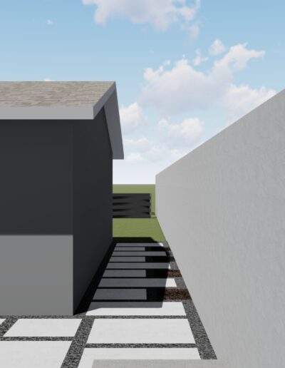 Modern house with a narrow passageway and contrasting pavement patterns.